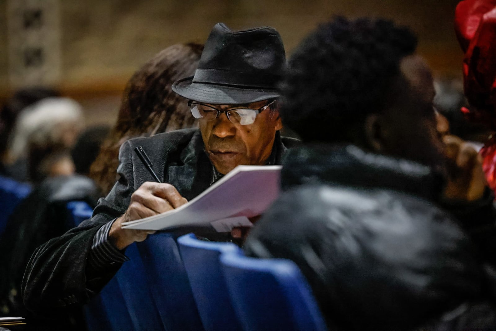 Miquel Guerra fills out paperwork before a naturalization ceremony held at Springboro High School Thursday March 23, 2023. Jim Noelker/Staff