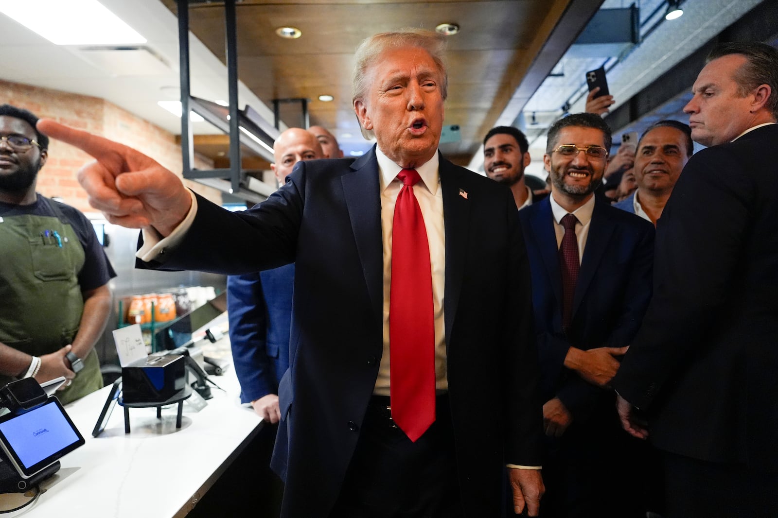 Republican presidential nominee former President Donald Trump talks as he visits The Great Commoner, Friday, Nov. 1, 2024, in Dearborn, Mich. (AP Photo/Julia Demaree Nikhinson)