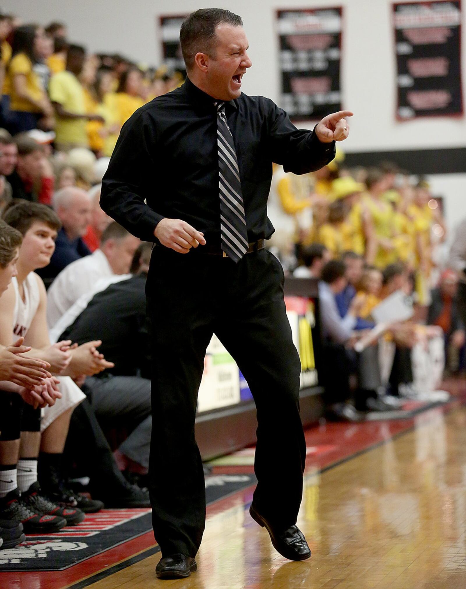 Brian Bales makes a point to his Franklin boys basketball team during a game against visiting Monroe on Jan. 29, 2015. Bales is also the FHS athletic director. JOURNAL-NEWS FILE PHOTO