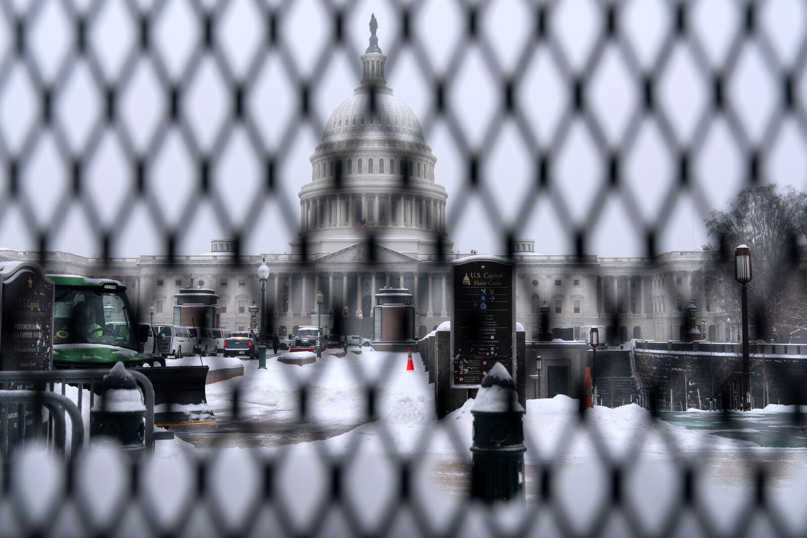 A snowplow clears the area as snow blankets Capitol Hill ahead of a joint session of Congress to certify the votes from the Electoral College in the presidential election in Washington, Monday, Jan. 6, 2025. (AP Photo/Jose Luis Magana)