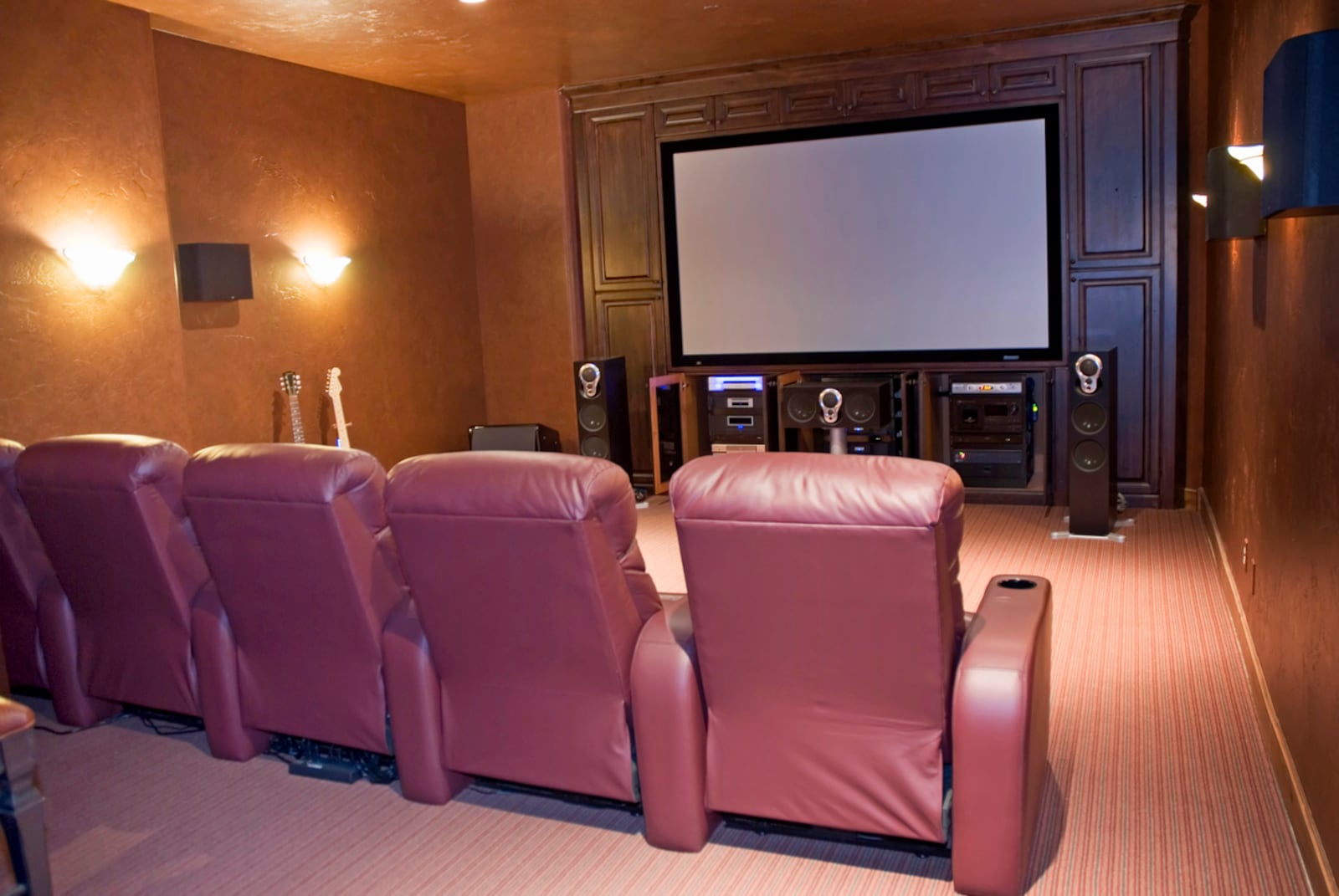 Homes with more than two people watching movies together may benefit from multiple recliners in the cinema room. Cupholders would be a plus. iSTOCK