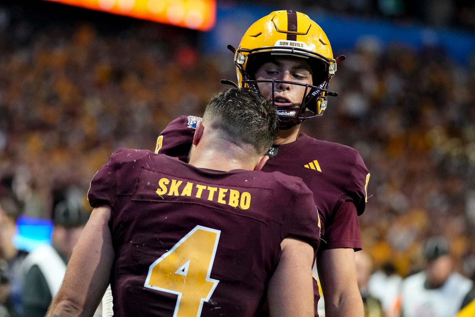 Arizona State running back Cam Skattebo (4) celebrates his touchdown against Texas with Arizona State quarterback Sam Leavitt during the second half in the quarterfinals of a College Football Playoff game, Wednesday, Jan. 1, 2025, in Atlanta. (AP Photo/Brynn Anderson)