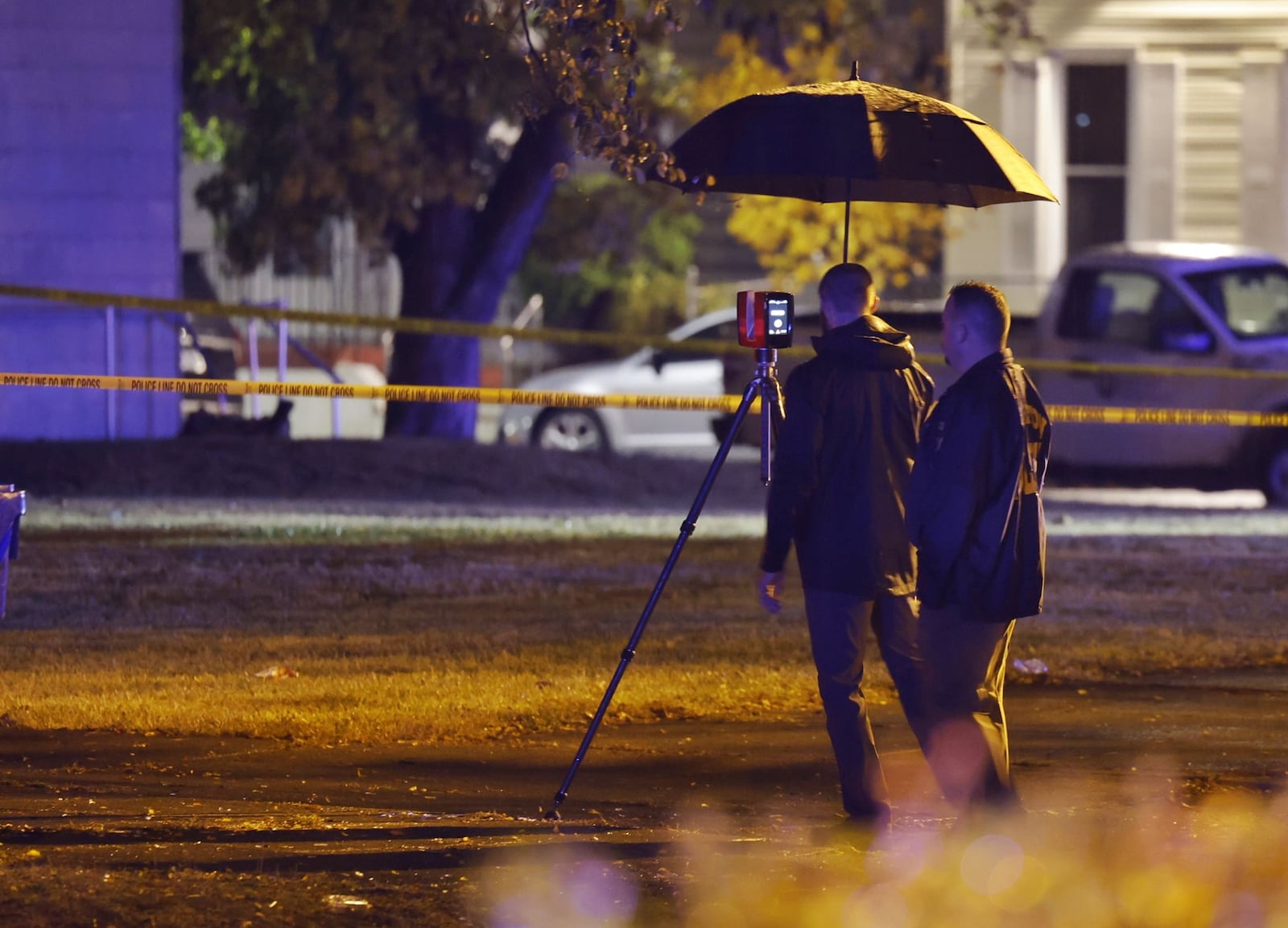 Police investigate after three people were shot Tuesday night, Oct. 25, 2022 in the 700 block of Second Street in Hamilton. Two of those shot have died and a child was also hit by bullet fragments. NICK GRAHAM/STAFF