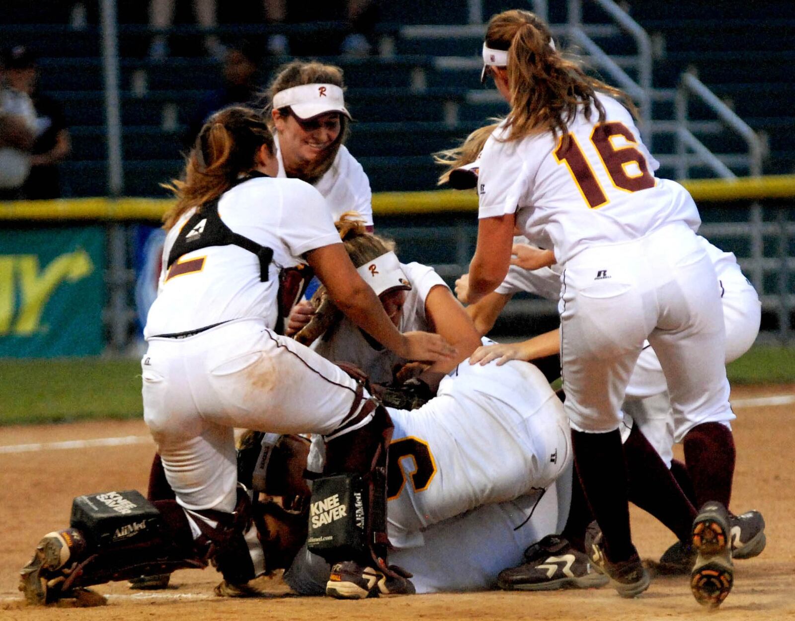 Ross High School’s softball players celebrate June 6, 2009, after defeating Bellville Clear Fork 4-2 to claim the Division II state championship at Firestone Stadium in Akron. CONTRIBUTED PHOTO BY DAVID A. MOODIE