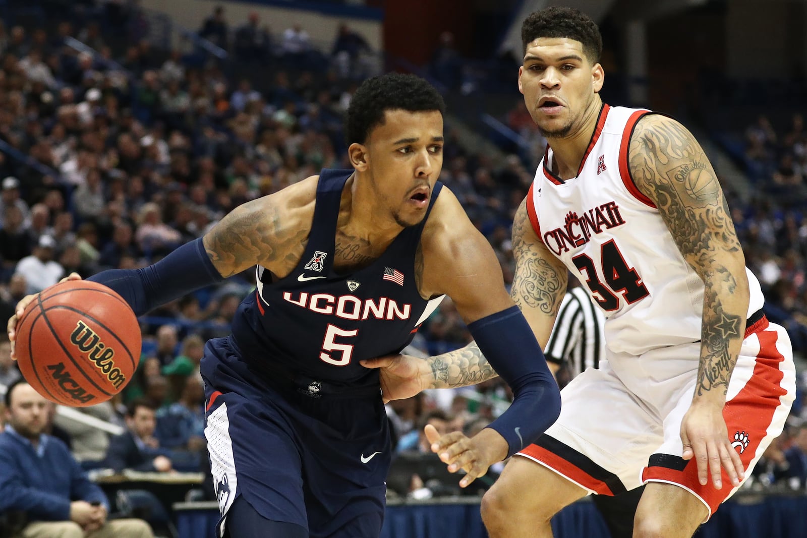 HARTFORD, CT - MARCH 11: Vance Jackson #5 of the Connecticut Huskies drives against Jarron Cumberland #34 of the Cincinnati Bearcats during the first half of the semifinal round of the AAC Basketball Tournament at the XL Center on March 11, 2017 in Hartford, Connecticut. (Photo by Maddie Meyer/Getty Images)