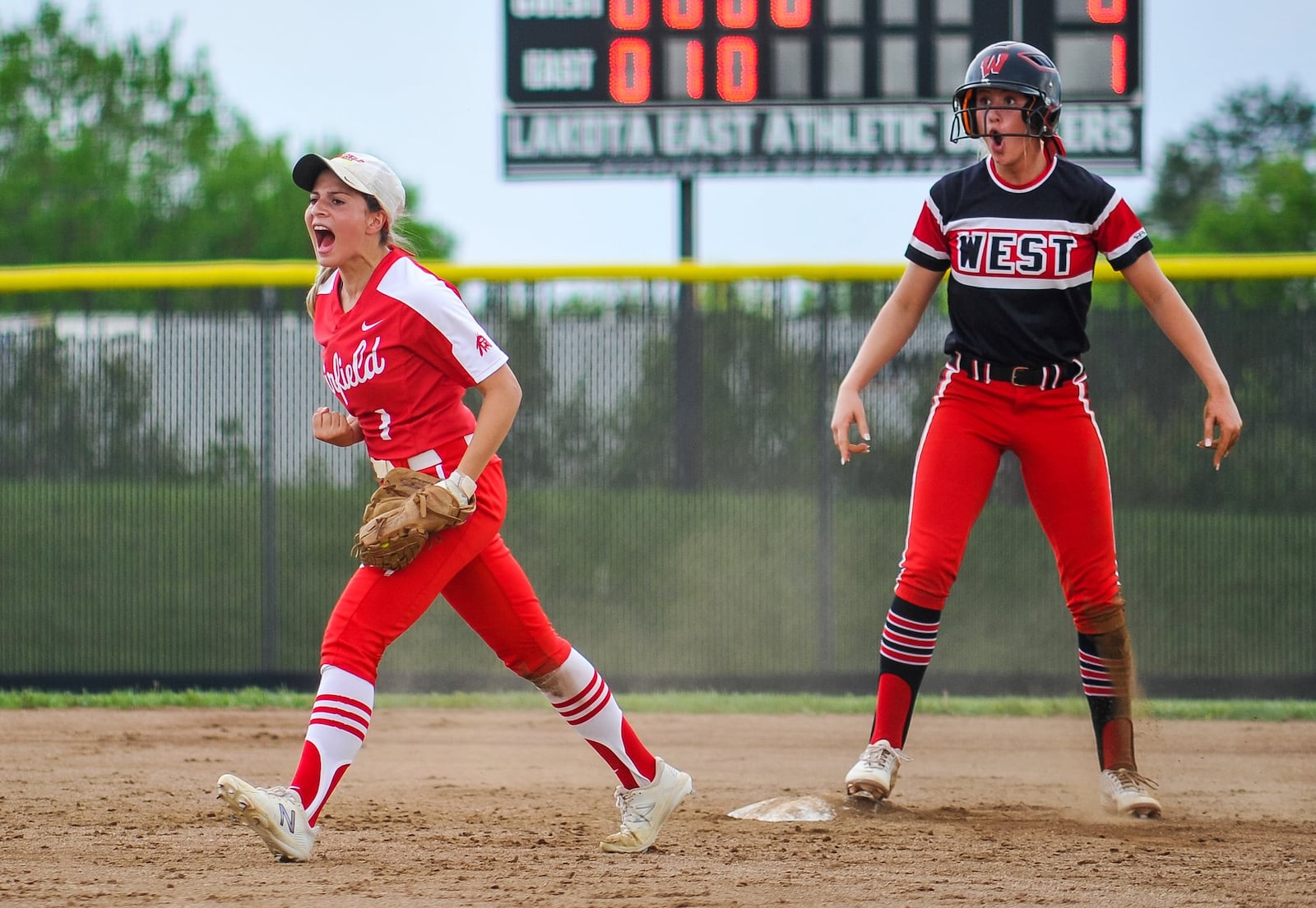 Fairfield’s Maiah Hodge celebrates tagging out Lakota West’s Alyssa Triner at second base during Friday’s Division I district softball final at Lakota East. West won 8-2. NICK GRAHAM/STAFF