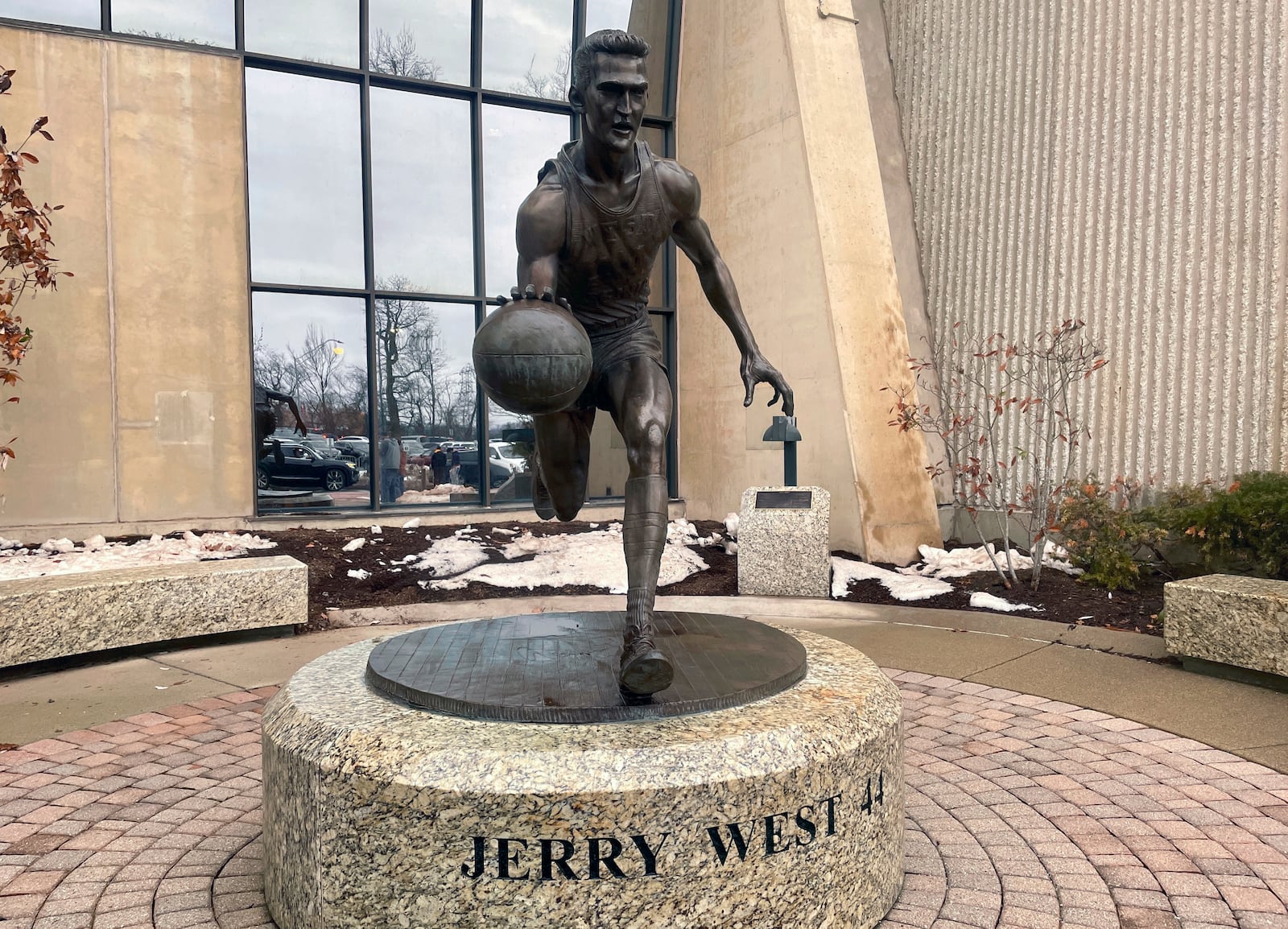 A statue honoring NBA great Jerry West, stands outside the West Virginia University Coliseum, in Morgantown, W.Va., Saturday, Jan. 18, 2025, as fans arrive for an NCAA college basketball game between Iowa State and West Virginia. (AP Photo/John Raby)