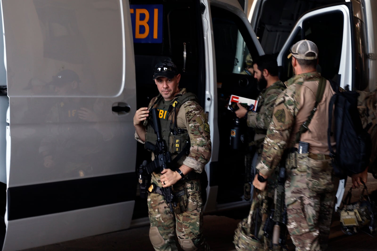 FBI personnel arrive at the Caesars Superdome ahead of the Sugar Bowl NCAA College Football Playoff game, Thursday, Jan. 2, 2025, in New Orleans. (AP Photo/Butch Dill)