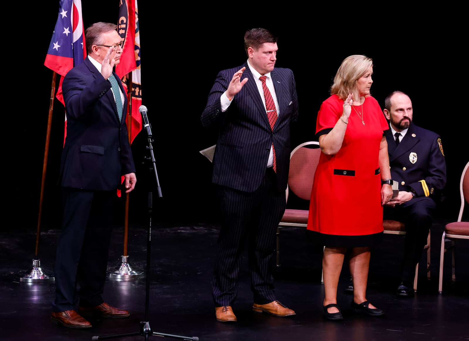 Left to right: Tim Meyers, Matt Davidson and Gwen Brill are sworn in as Fairfield city council members by Butler County Common Pleas Court Judge Keith M. Spaeth during a ceremony Monday, Dec. 27, 2021 at the Fairfield Community Arts Center. NICK GRAHAM / STAFF