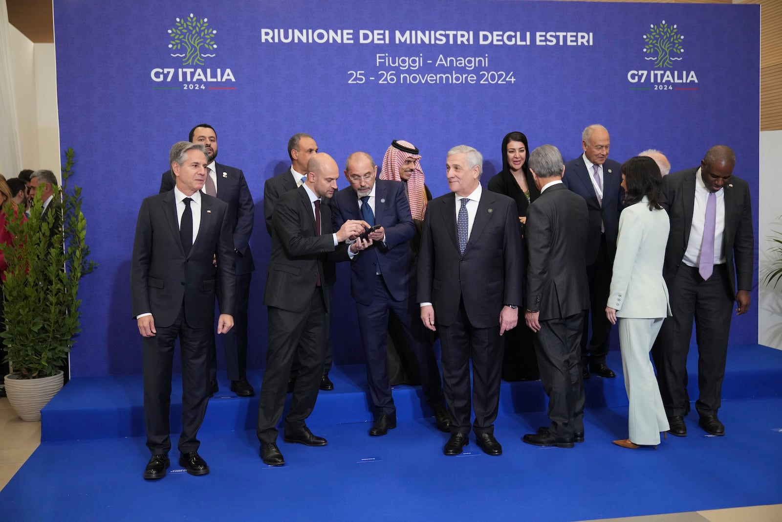 Foreign Ministers of the G7 and from different Arab countries wait to pose for a family photo at the G7 of foreign Ministers in Fiuggi, some 70 kilometers south-east of Rome, Monday, Nov. 25, 2024. (AP Photo/Alessandra Tarantino)