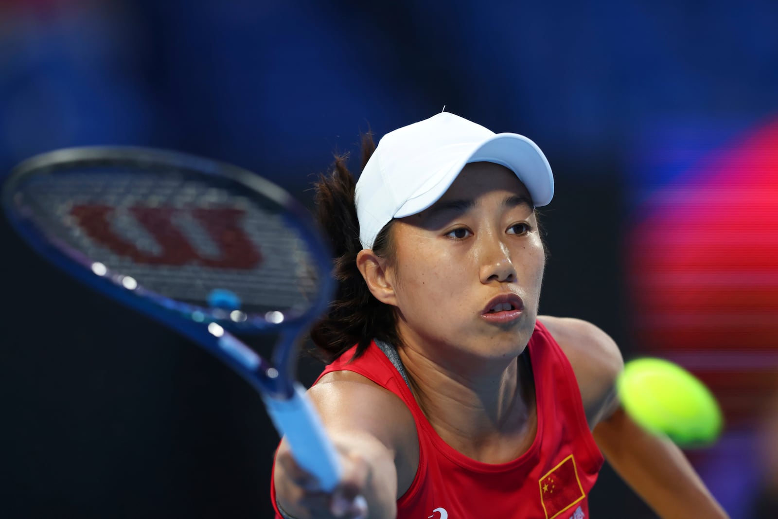 Shuai Zhang of China hits a return shot to Coco Gauff of the United States during their United Cup tennis match in Perth, Australia, Wednesday, Jan. 1, 2025. (AP Photo/Trevor Collens)