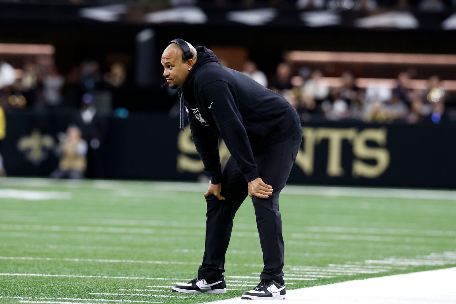 Las Vegas Raiders head coach Antonio Pierce watches from the sideline during the first half of an NFL football game against the New Orleans Saints, Sunday, Dec. 29, 2024, in New Orleans. (AP Photo/Butch Dill)