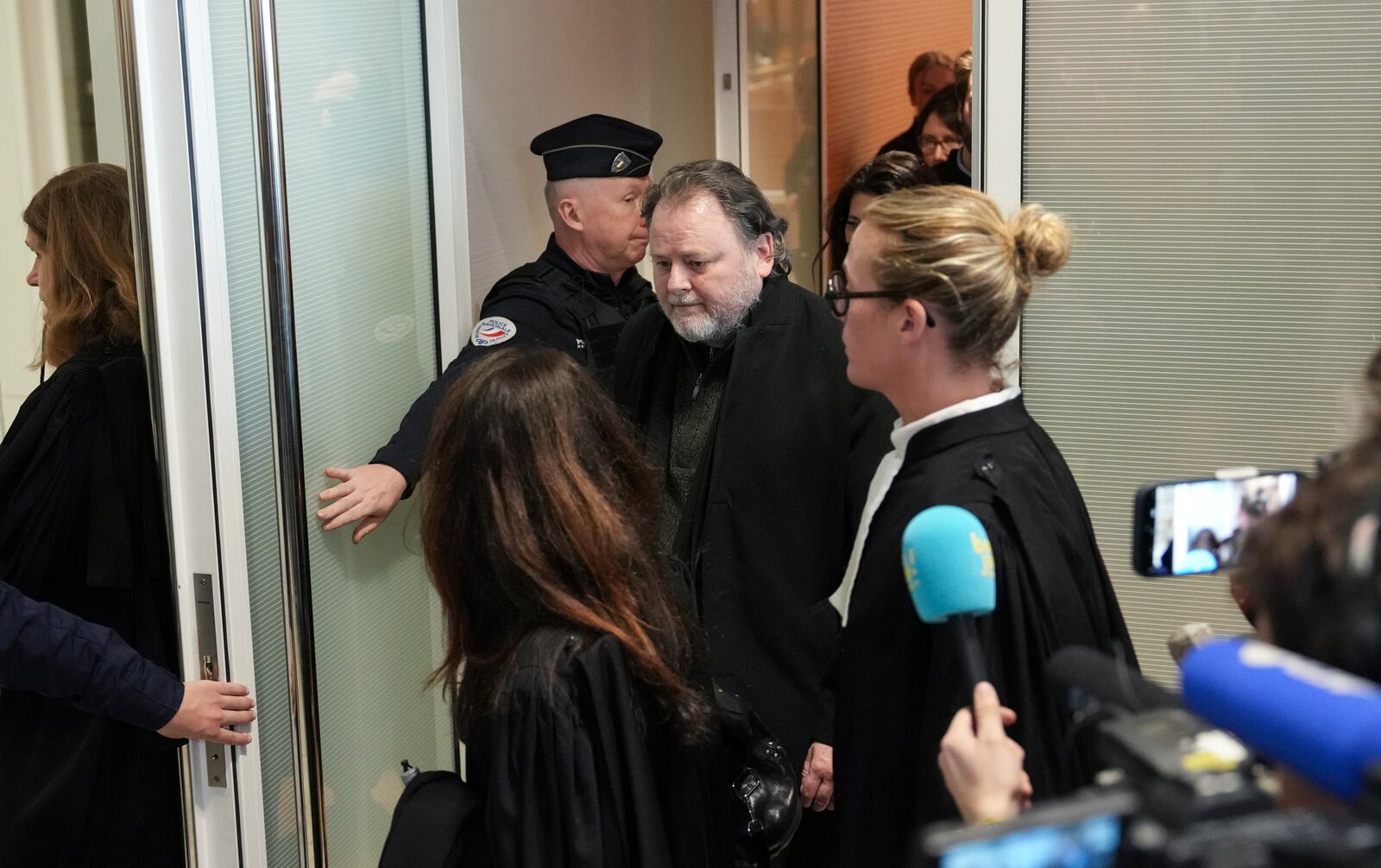 French filmmaker Christophe Ruggia leaves the courtroom in Paris, Monday, Feb. 3, 2025, after he was found guilty of sexual assault on French actor Adèle Haenel when she was between 12 and 15 in the early 2000s, in the country’s first big #MeToo trial. (AP Photo/Aurelien Morissard)