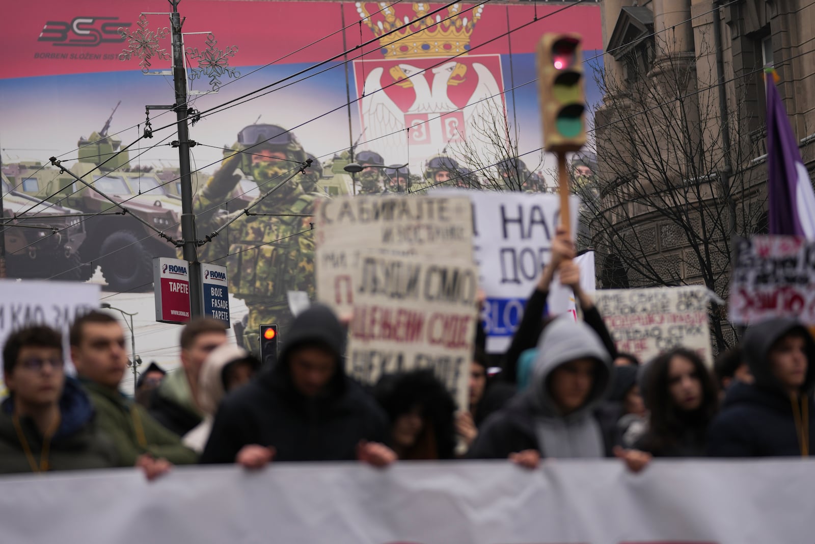 Students call for a general strike as they stop traffic during a protest to commemorate the 15 victims killed after a railway concrete canopy fell in November and to demand accountability for the tragedy, in Belgrade, Serbia, Friday, Jan. 24, 2025. (AP Photo/Darko Vojinovic)