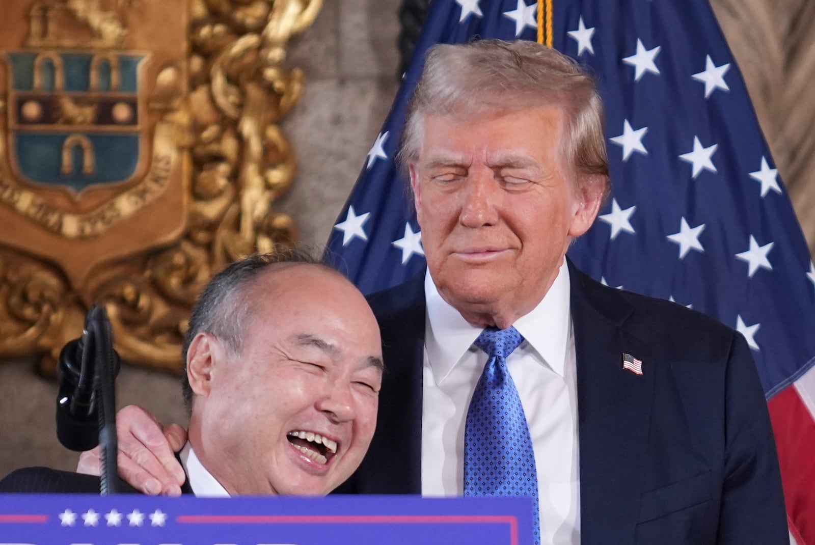 SoftBank Group CEO Masayoshi Son smiles with President-elect Donald Trump during a news conference at Mar-a-Lago, Monday, Dec. 16, 2024, in Palm Beach, Fla. (AP Photo/Evan Vucci)