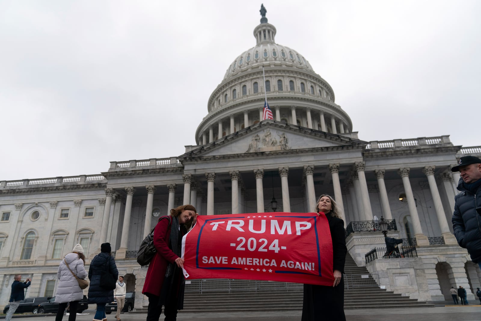 Supporters of President-elect Donald Trump take pictures as they celebrate outside of the U.S. Capitol, Sunday, Jan. 19, 2025, in Washington. (AP Photo/Jose Luis Magana)