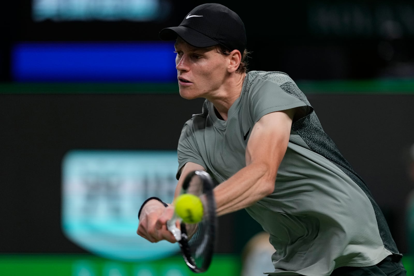 Jannik Sinner of Italy returns a shot against Novak Djokovic of Serbia during the men's singles finals match in the Shanghai Masters tennis tournament at Qizhong Forest Sports City Tennis Center in Shanghai, China, Sunday, Oct. 13, 2024. (AP Photo/Andy Wong)