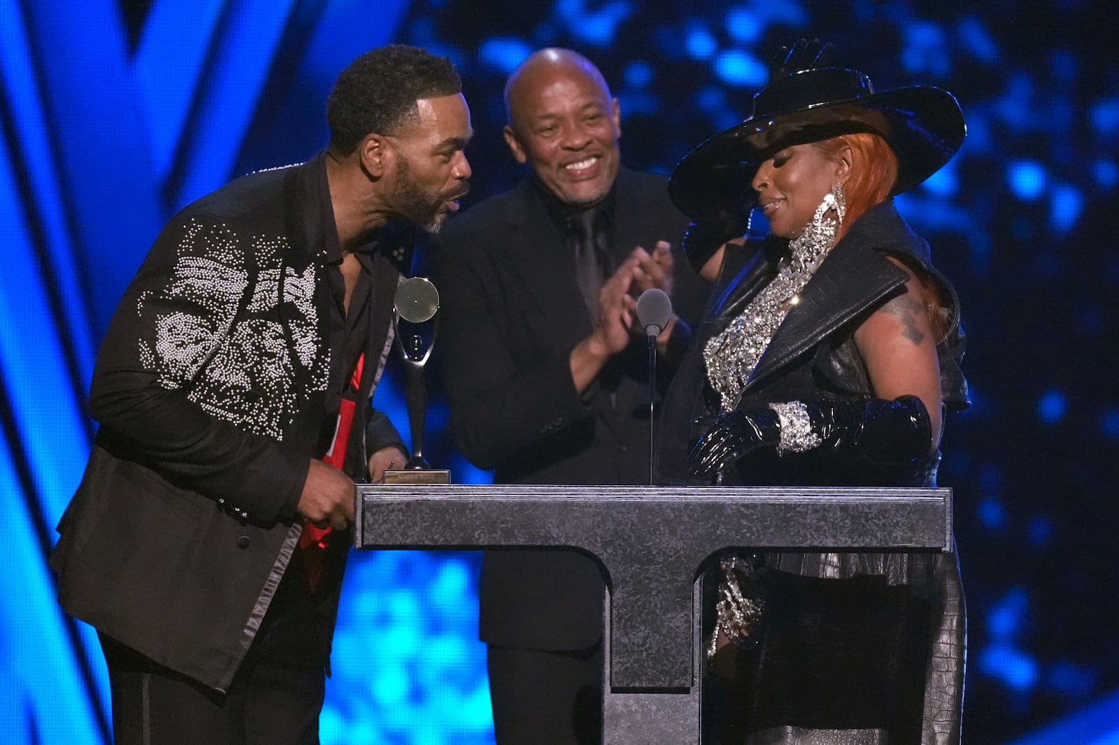 Method Man, from left, Dr. Dre, and Mary J. Blige appear during the 39th Annual Rock & Roll Hall of Fame Induction Ceremony on Saturday, Oct. 19, 2024, at Rocket Mortgage FieldHouse in Cleveland. (AP Photo/Chris Pizzello)