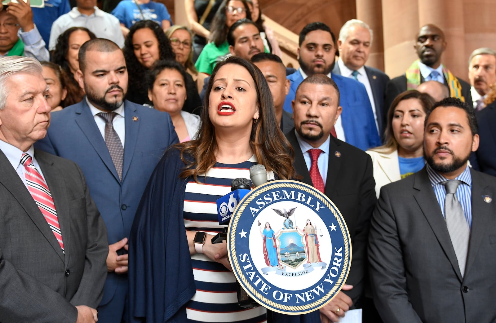 FILE - Asemblywoman Catalina Cruz, D- Jackson Heights, center, speaks in favor of legislation for the Green Light Bill granting undocumented Immigrant driver's licenses during a rally at the state Capitol Monday, June 17, 2019, in Albany, N.Y. (AP Photo/Hans Pennink, File)