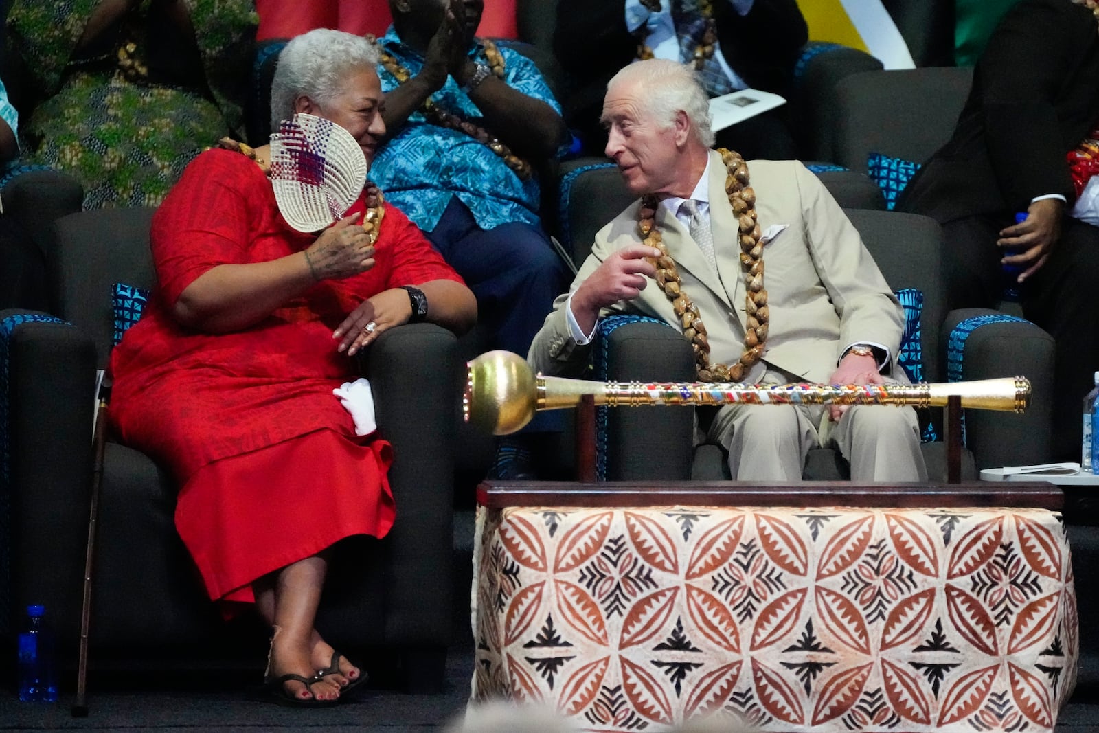 Britain's King Charles and Samoan Prime Minister Afioga Fiamē Naomi Mataʻafa, left, talk during the opening ceremony for the Commonwealth Heads of Government meeting in Apia, Samoa, Friday, Oct. 25, 2024. (AP Photo/Rick Rycroft/Pool)