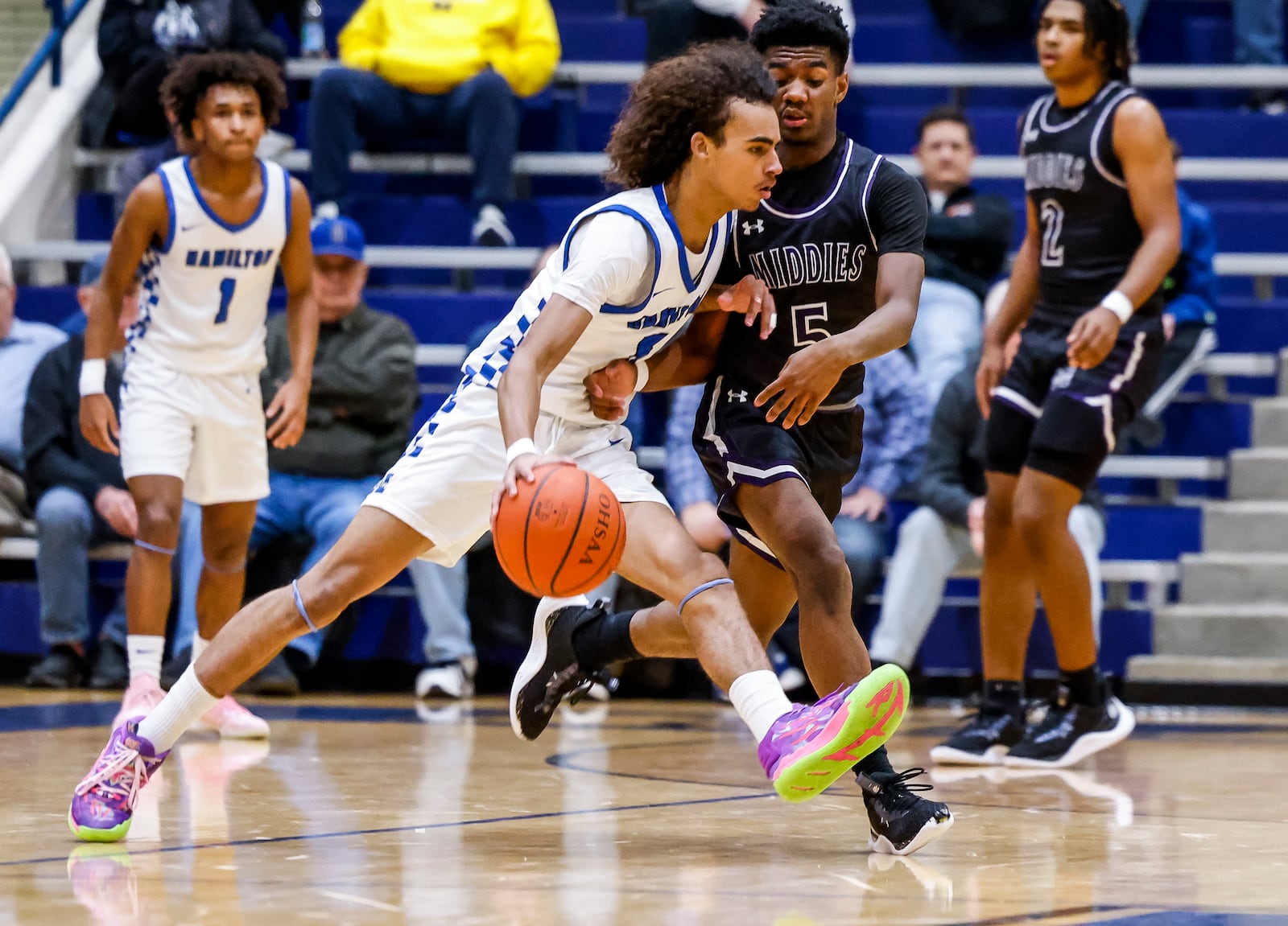 Hamilton's Deon'dre Tillery dribbles the ball defended by Middletown's Chancellor Knight Jr. during the Hamilton vs. Middletown basketball game Tuesday, Jan. 30, 2024 at Hamilton High School. Middletown won 47-38. NICK GRAHAM/STAFF