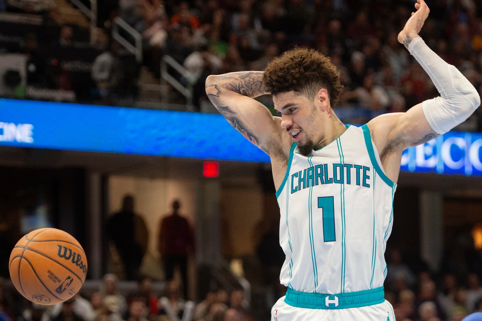 Charlotte Hornets' LaMelo Ball (1) watches the ball during the second half of an NBA basketball game against the Cleveland Cavaliers in Cleveland, Sunday, Nov 17, 2024. (AP Photo/Phil Long)