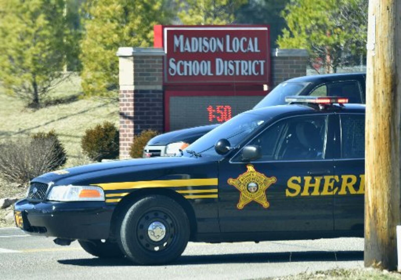 Butler County sheriff’s deputies block the Ohio 122 entrance to Madison Jr./Sr. High School on Feb. 29, 2016, after a school shooting. 