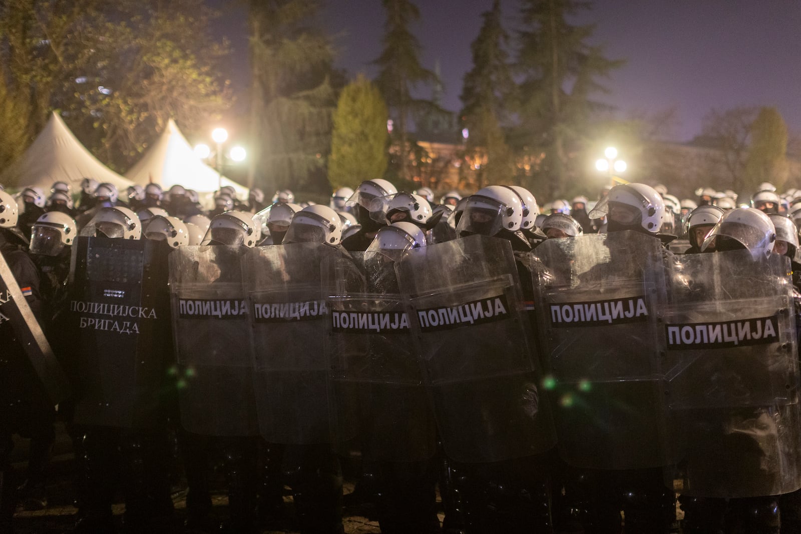 Riot police stand guard on the side of a street during a major anti-corruption rally led by university students in Belgrade, Serbia, Saturday, March 15, 2025. (AP Photo/Marko Drobnjakovic)