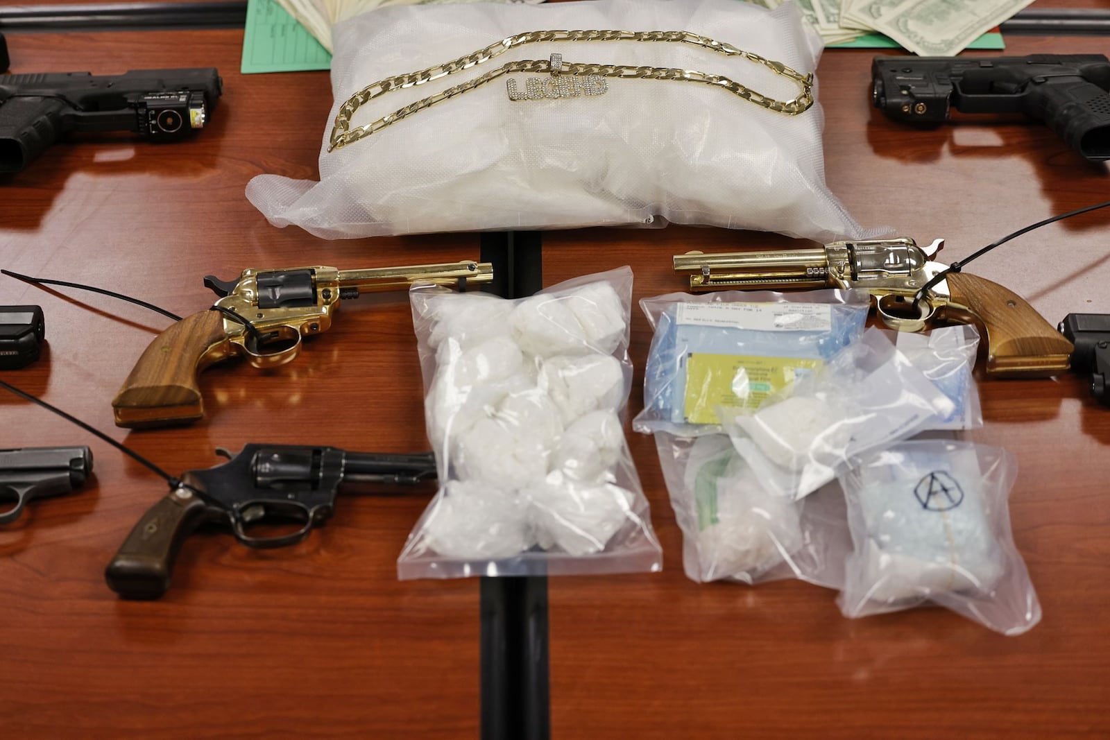 An extensive drug trafficking investigation resulted in the arrest of a Hamilton man and the seizure of drugs, guns and cash, according to the Butler County Sheriff’s Office.