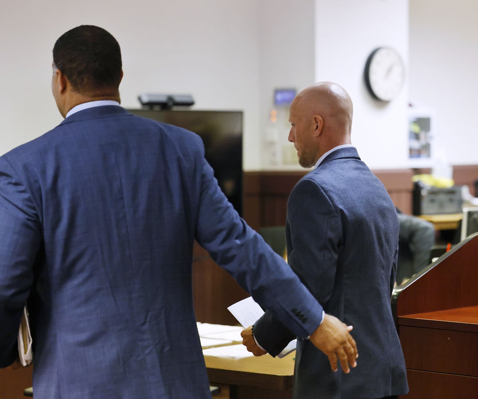 Hamilton Police Sgt. Casey Johnson, right, appeared in Butler County Area I Court Thursday on charges of vandalism and OVI. NICK GRAHAM/Staff