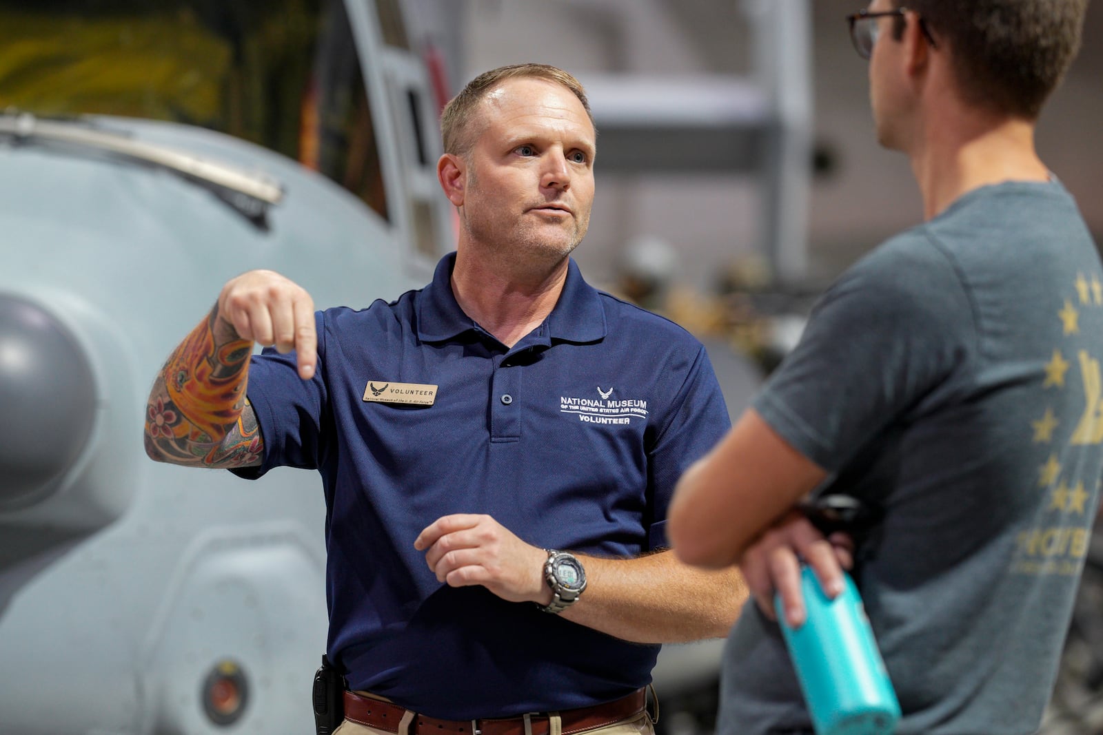 Brian Luce, left, speaks with museum visitor Ben Perkins inside of the Wright Patterson AFB Air Force Museum, Friday, Aug. 9, 2024, in Dayton, Ohio. (AP Photo/Jeff Dean)