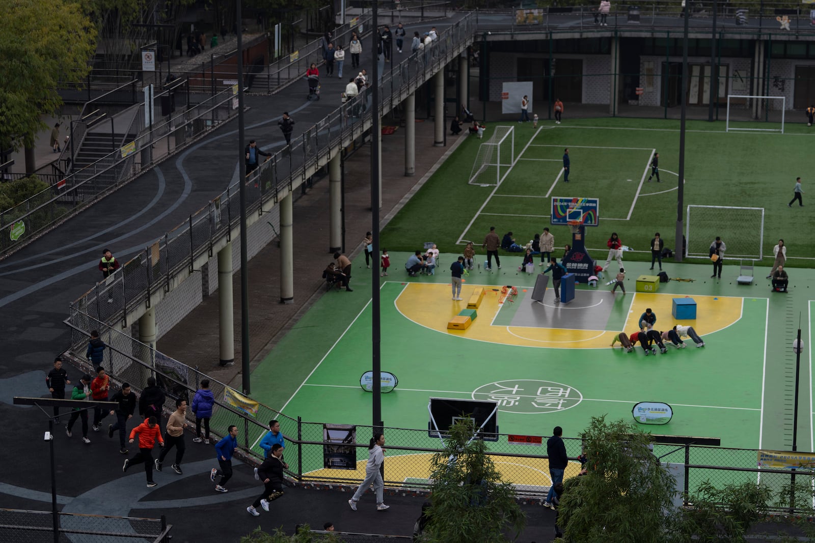 Visitors enjoy the sports facilities at the West Village project by Pritzker Architecture Prize winner Chinese architect Liu Jiakun in Chengdu in southwestern China's Sichuan province on Sunday, March 2, 2025. (AP Photo/Ng Han Guan)