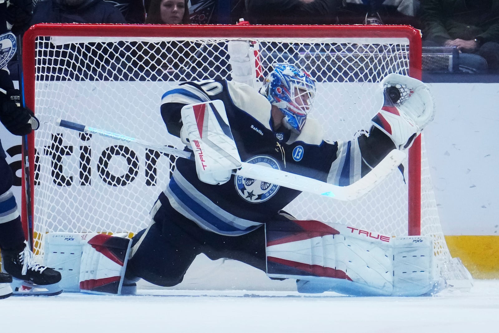 Columbus Blue Jackets goaltender Elvis Merzlikins (90) makes a save in the second period of an NHL hockey game against the New Jersey Devils Thursday, Dec. 19, 2024, in Columbus, Ohio. (AP Photo/Sue Ogrocki)