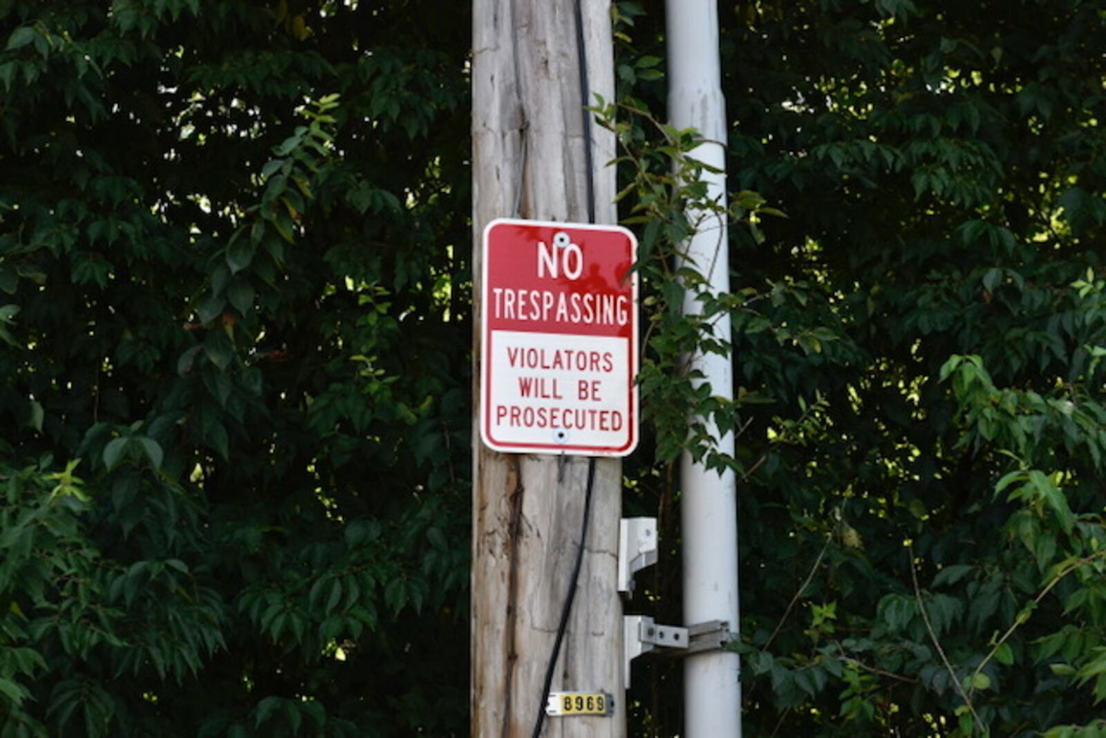 A no-trespassing sign marks the area. 