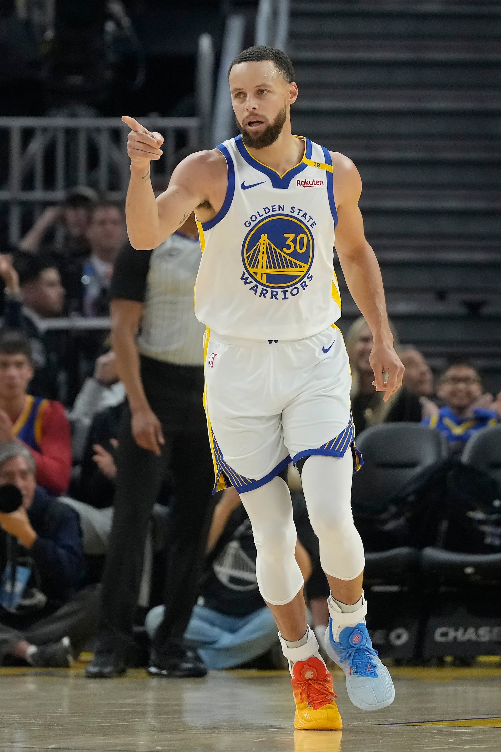 Golden State Warriors guard Stephen Curry (30) gestures after making a 3-point basket during the first half of an NBA basketball game against the Detroit Pistons in San Francisco, Saturday, March 8, 2025. (AP Photo/Jeff Chiu)