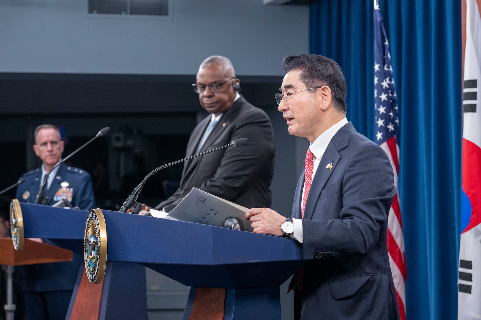 Defense Secretary Lloyd Austin, center, listens as South Korean Defense Minister Kim Yong Hyun, right, speaks during a joint press briefing at the Pentagon on Wednesday, Oct. 30, 2024 in Washington. At left is Pentagon Press Secretary Maj. Gen. Pat Ryder. (AP Photo/Kevin Wolf)