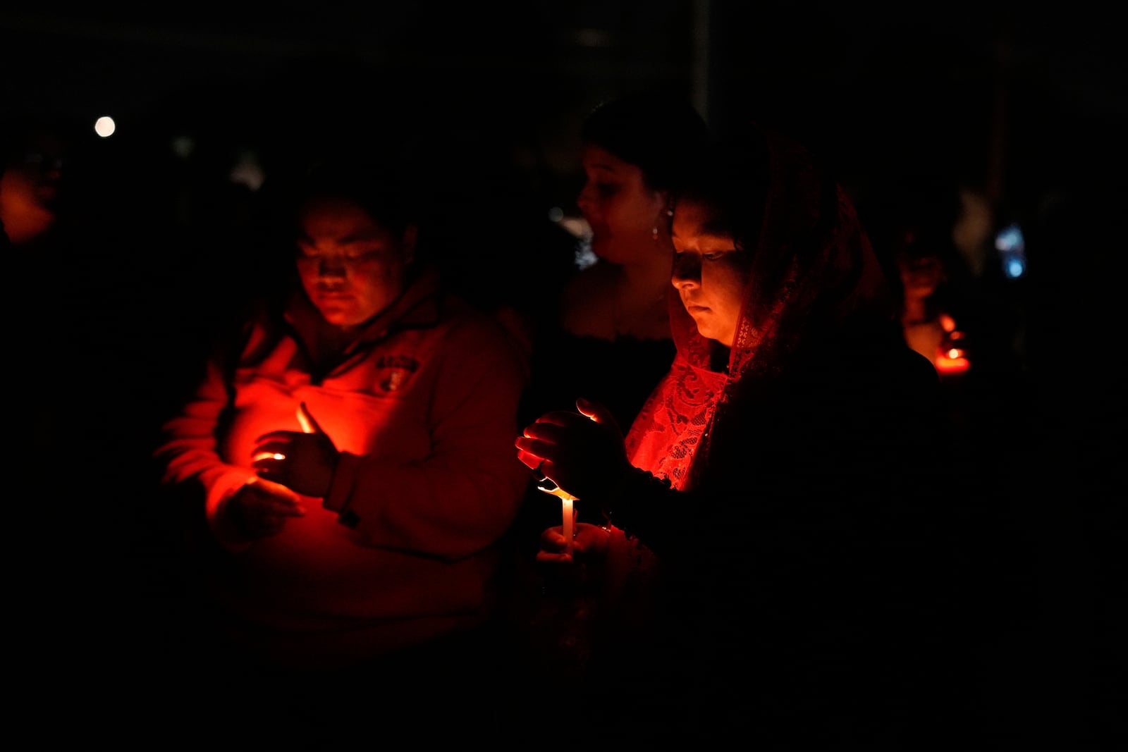 People attend a vigil for slain Native American teen Emily Pike in Mesa, Ariz., Thursday, March 6, 2025. (AP Photo/Samantha Chow)