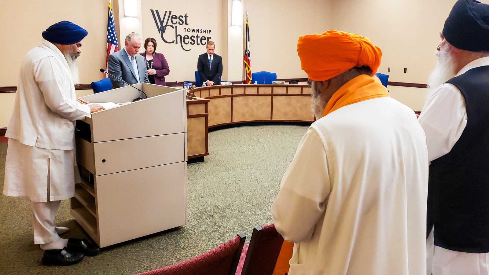 Amrik Singh, left, head priest of Guru Nanak Society of Greater Cincinnati, offered prayers for the Sikh community and those involved in the quadruple homicide last week during the West Chester Township trustees meeting Tuesday, May 7, 2019. NICK GRAHAM/STAFF