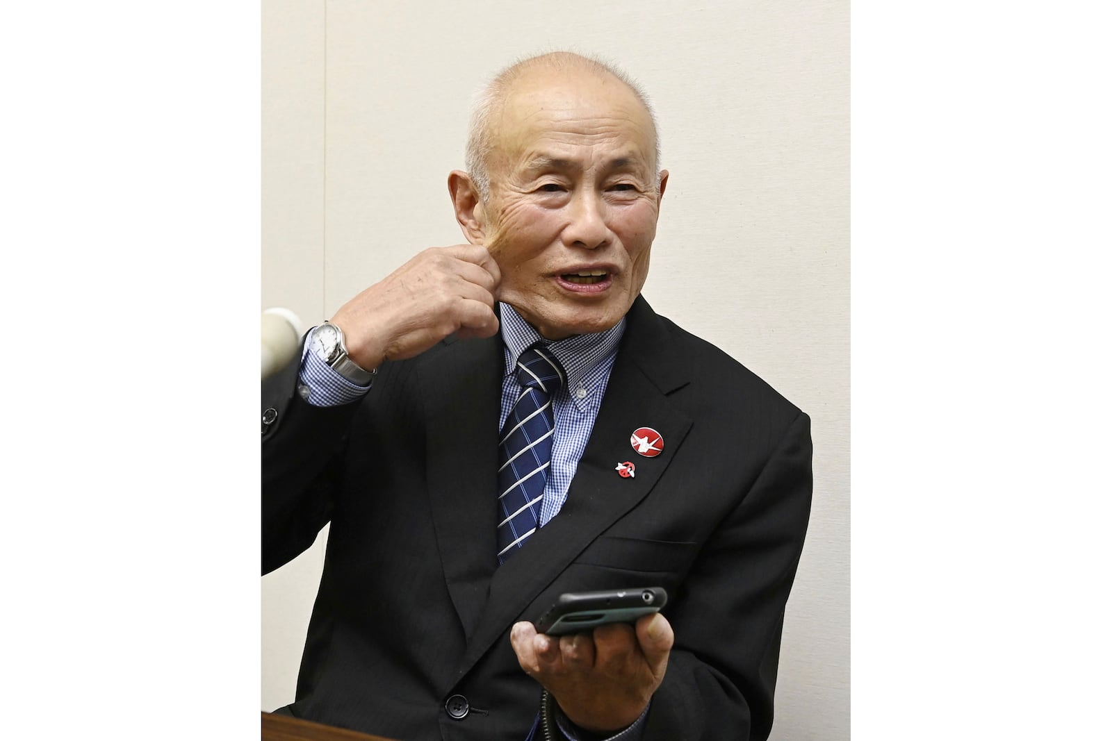 Toshiyuki Mimaki, president of Nihon Hidankyo, or the Japan Confederation of A- and H-Bomb Sufferers Organizations, reacts as he speaks to media members in Hiroshima, western Japan, Friday, Oct. 11, 2024, following Nihon Hidankyo's winning the Nobel Peace Prize. (Moe Sasaki/Kyodo News via AP)