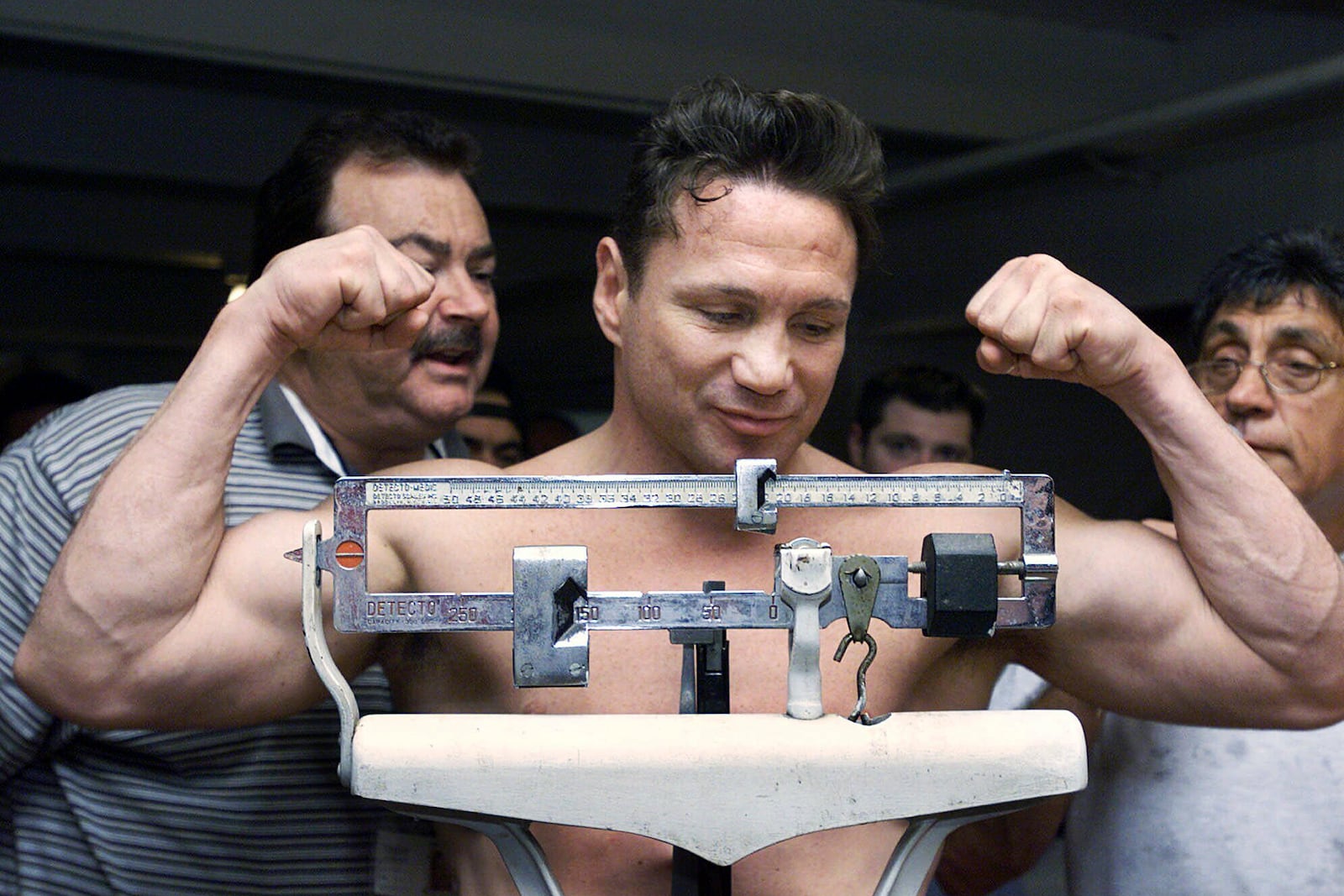 FILE - Vinny Paz, five-time former world champion boxer, smiles as he weighs in Thursday, July 26, 2001, in Cranston, R.I., for his fight against Irish Pat Lawler. (AP Photo/Victoria Arocho, File)