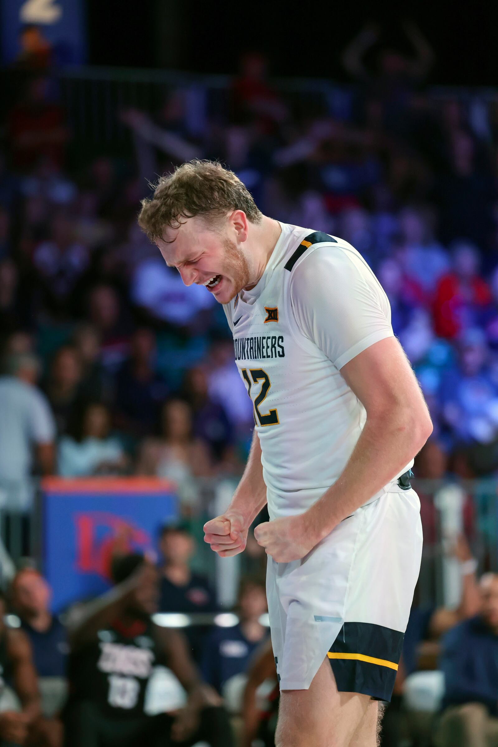 In this handout provided by Bahamas Visual Services, West Virginia's Tucker DeVries reacts during an NCAA college basketball game against Gonzaga at the Battle 4 Atlantis tournament in Paradise Island, Bahamas Wednesday, Nov. 27, 2024. (Tim Aylen/Bahamas Visual Services via AP)