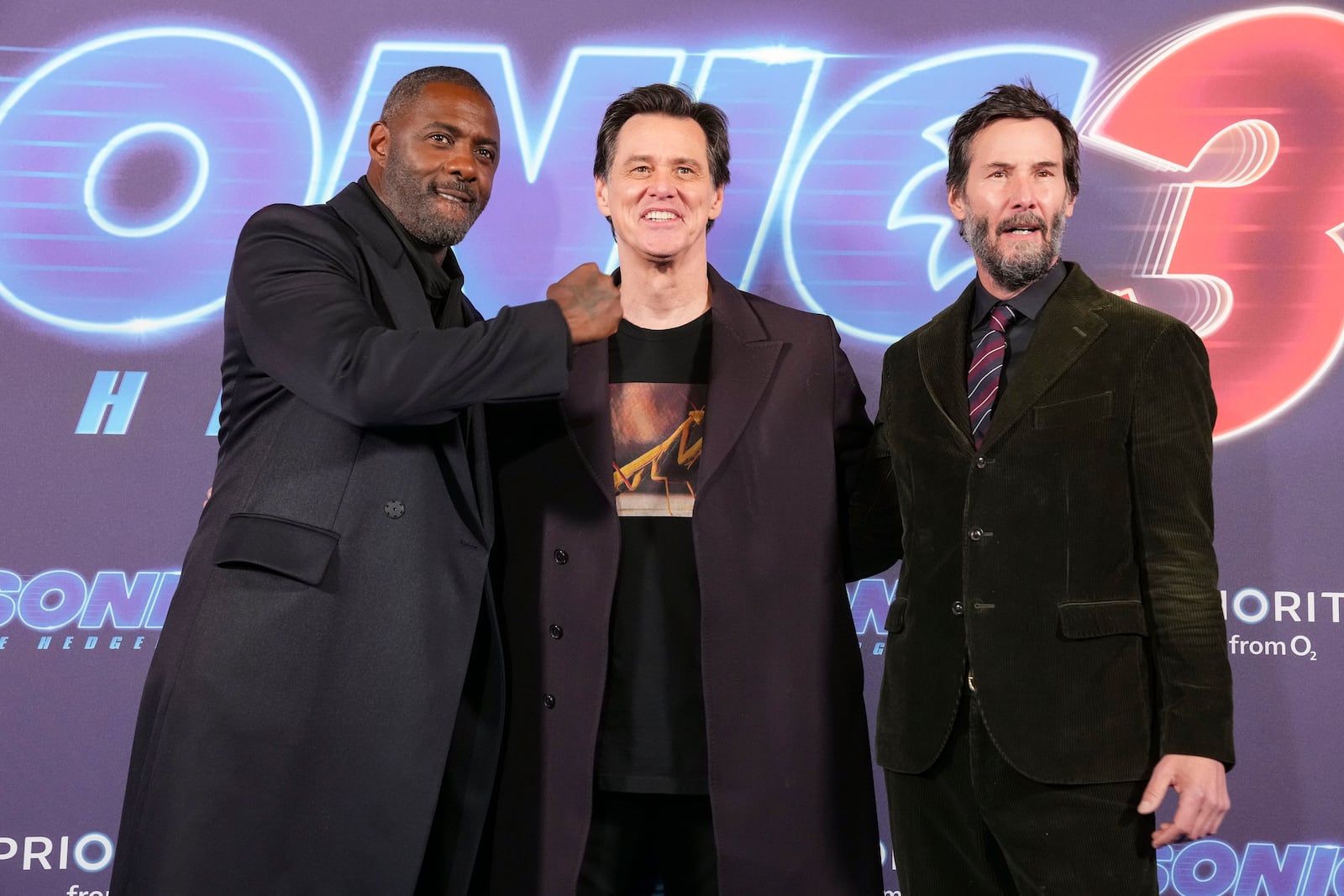 Idris Elba, from left, Jim Carrey and Keanu Reeves pose together for photographers upon arrival at the premiere of the film 'Sonic the Hedgehog 3' in London, on Tuesday, Dec. 10, 2024. (Photo by Scott A Garfitt/Invision/AP)