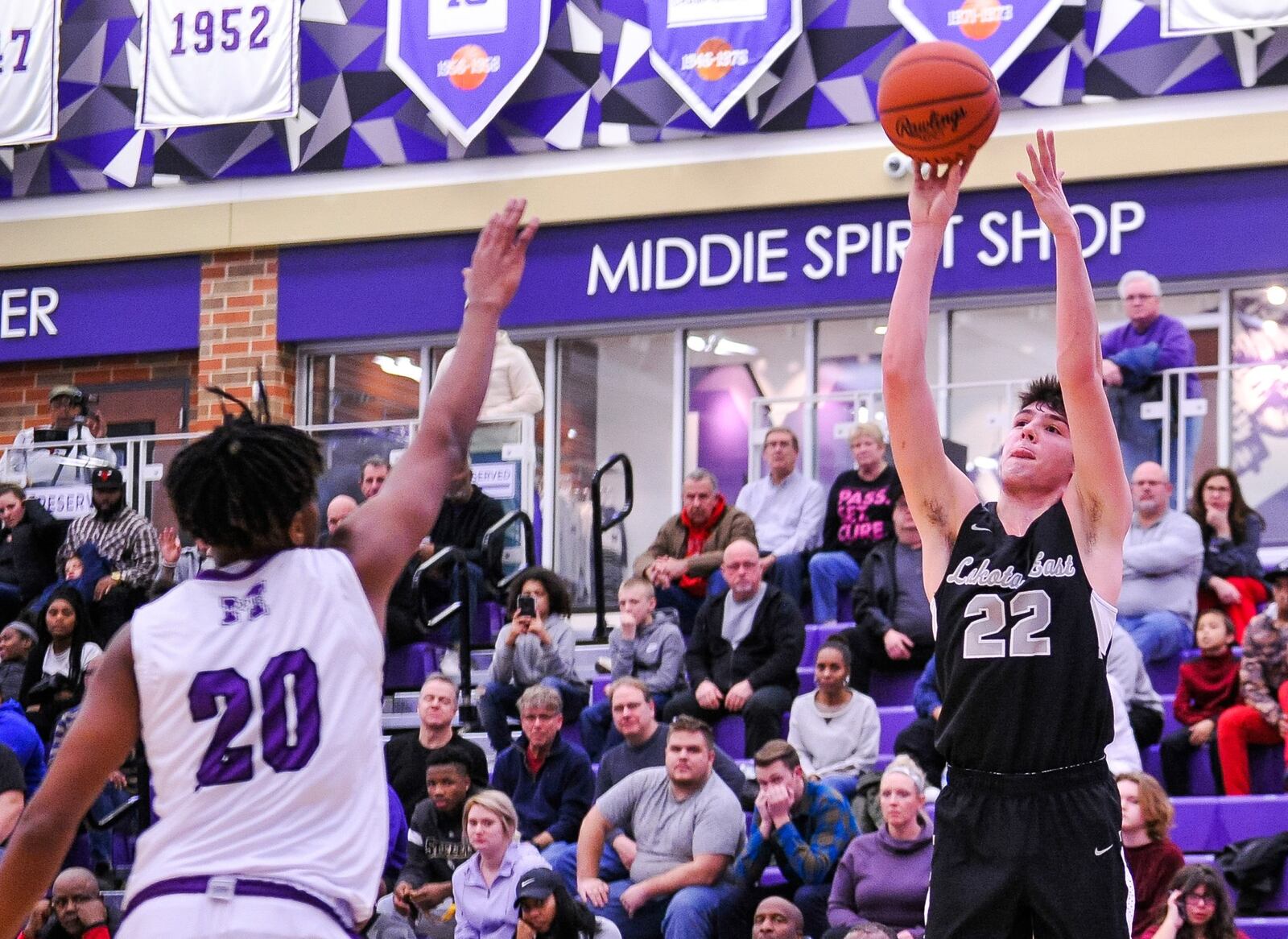 Lakota East’s Bash Wieland goes up for a shot defended by Middletown’s Johrdon Mumford during Tuesday night’s game at Wade E. Miller Arena in Middletown. East won 61-47. NICK GRAHAM/STAFF