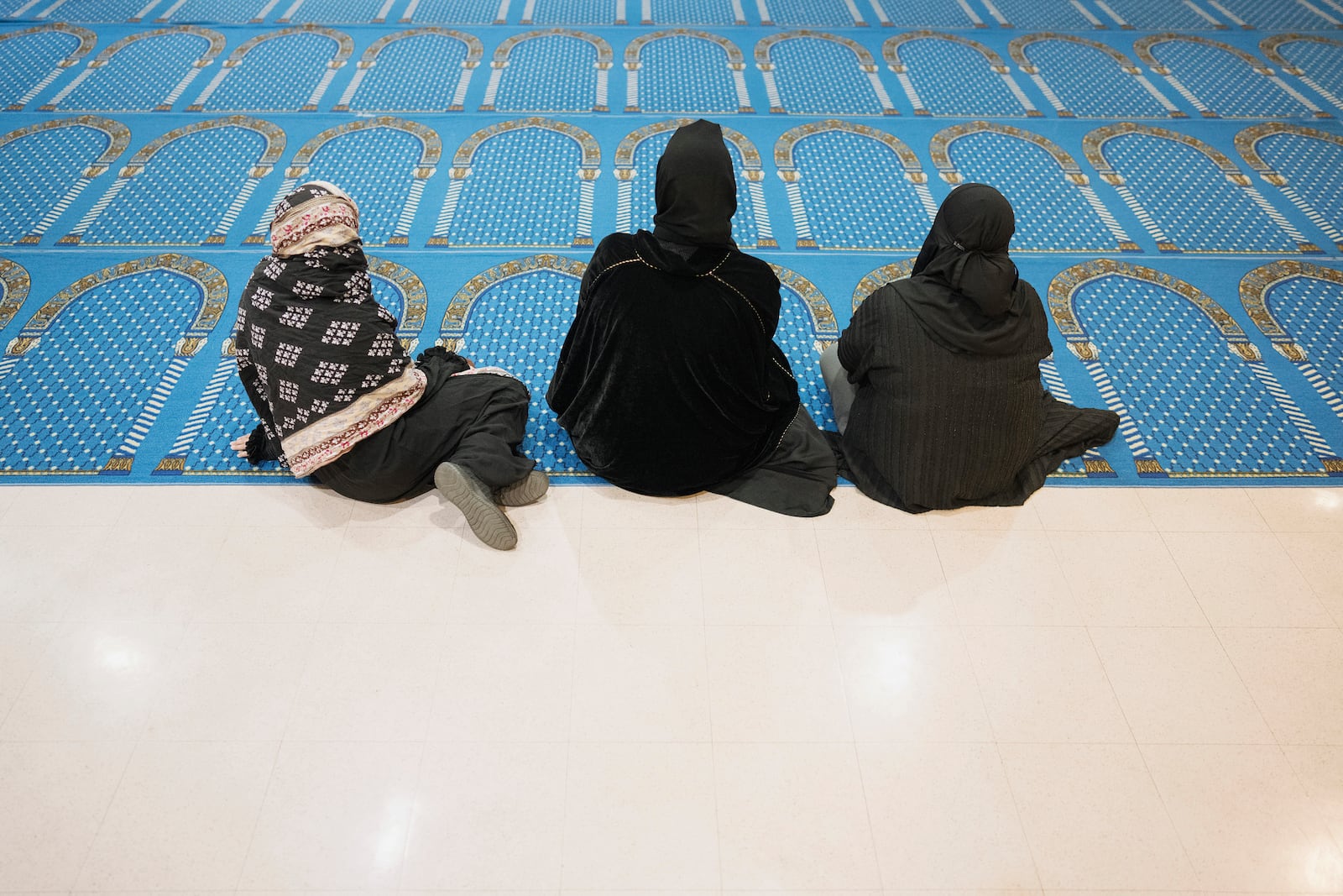 Women listen during a community gathering to discuss plans for Ramadan held for members of the Masjid Al-Taqwa at a school in Pasadena, California, Saturday, Feb. 15, 2025. (AP Photo/Eric Thayer)