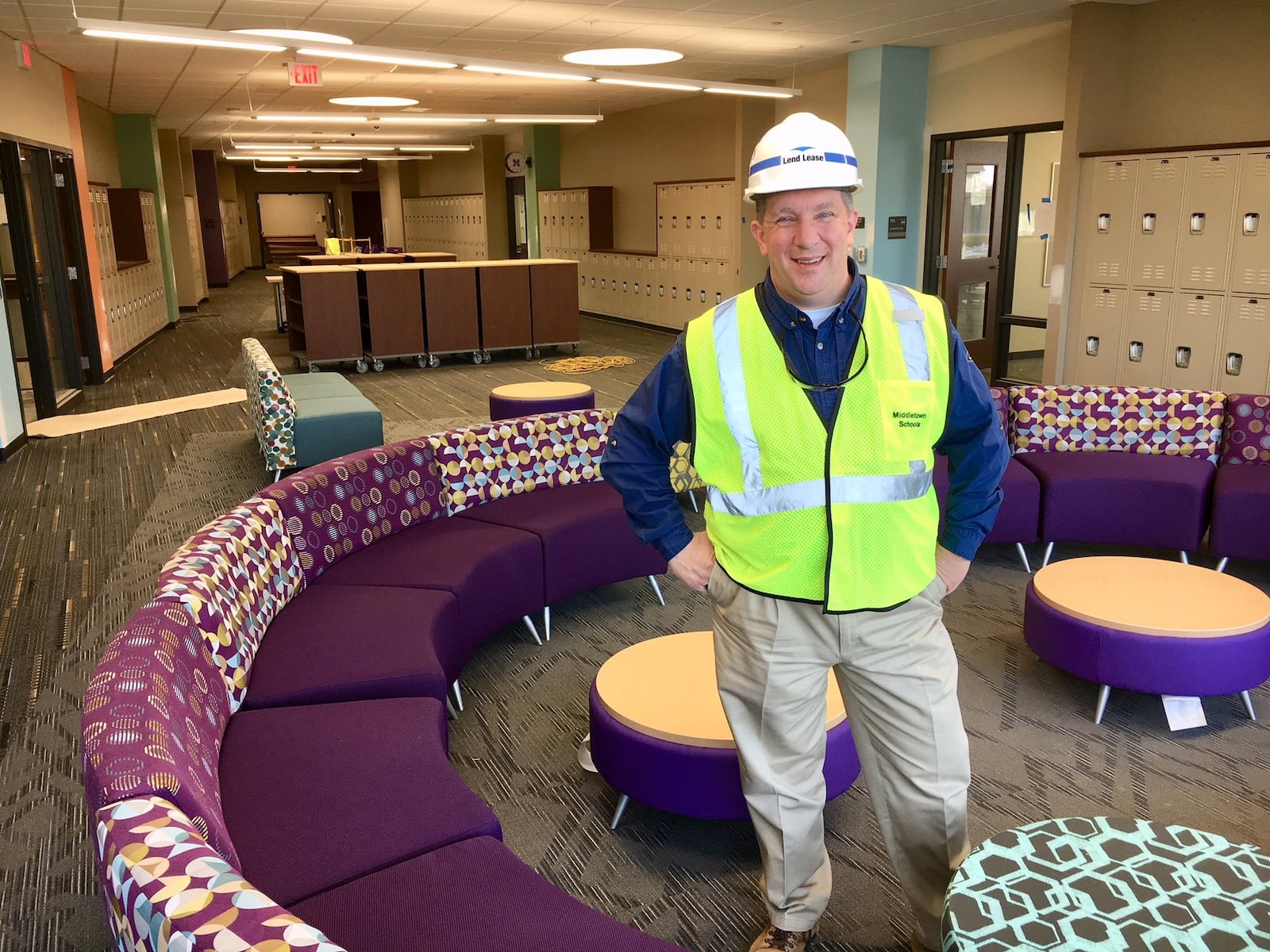 George Long, business manager for Middletown Schools, shows off one of the new learning pods between classrooms at the new Middletown Middle School now under construction.