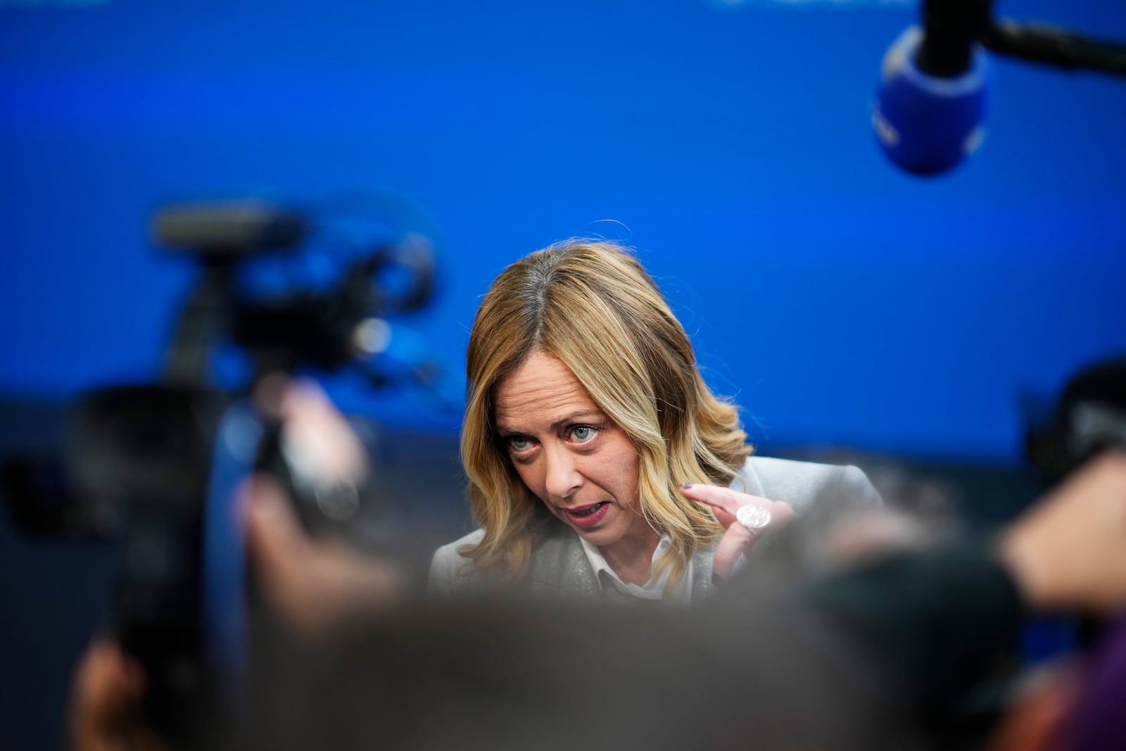 Italy's Prime Minister Giorgia Meloni speaks with the media as she arrives for an EU Summit at the Puskas Arena in Budapest, Hungary, Friday, Nov. 8, 2024. (AP Photo/Petr David Josek)