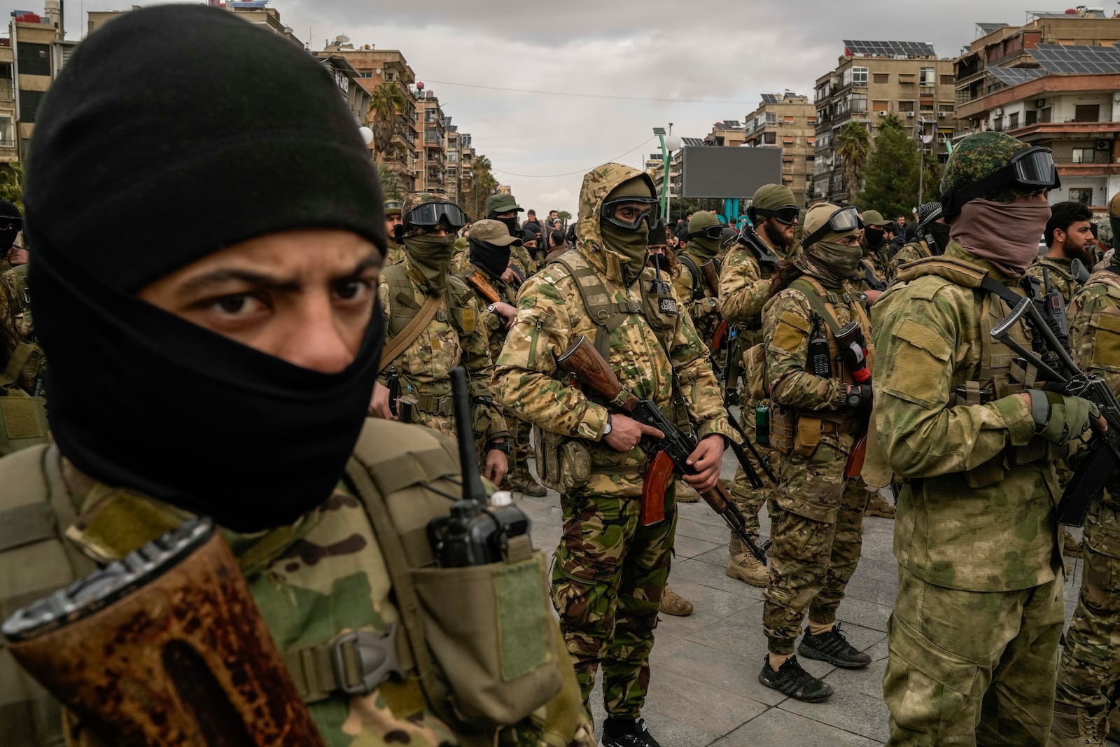 Members of the new armed forces, former rebels who overthrew Bashar Assad's government and now serve in the new Syrian government, stand in formation as they prepare for a military parade in downtown Damascus, Syria, Friday, Dec. 27, 2024. (AP Photo/Leo Correa)