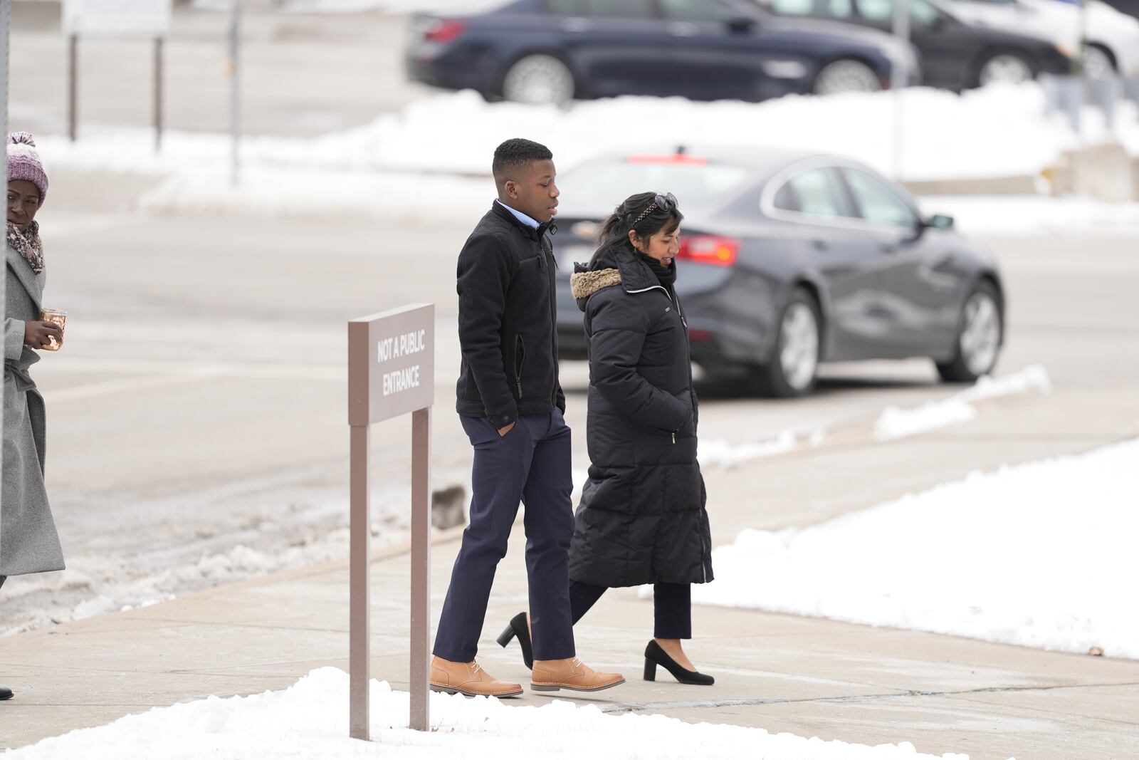 Ralph Yarl walks to the Clay County Courthouse to attend a hearing for Andrew Lester, who pleaded guilty charges stemming from a 2023 incident when Lester shot Yarl in the head after Yarl mistakenly knocked on the wrong door, Friday, Feb. 14, 2025, in Liberty, Mo. (AP Photo/Charlie Riedel)