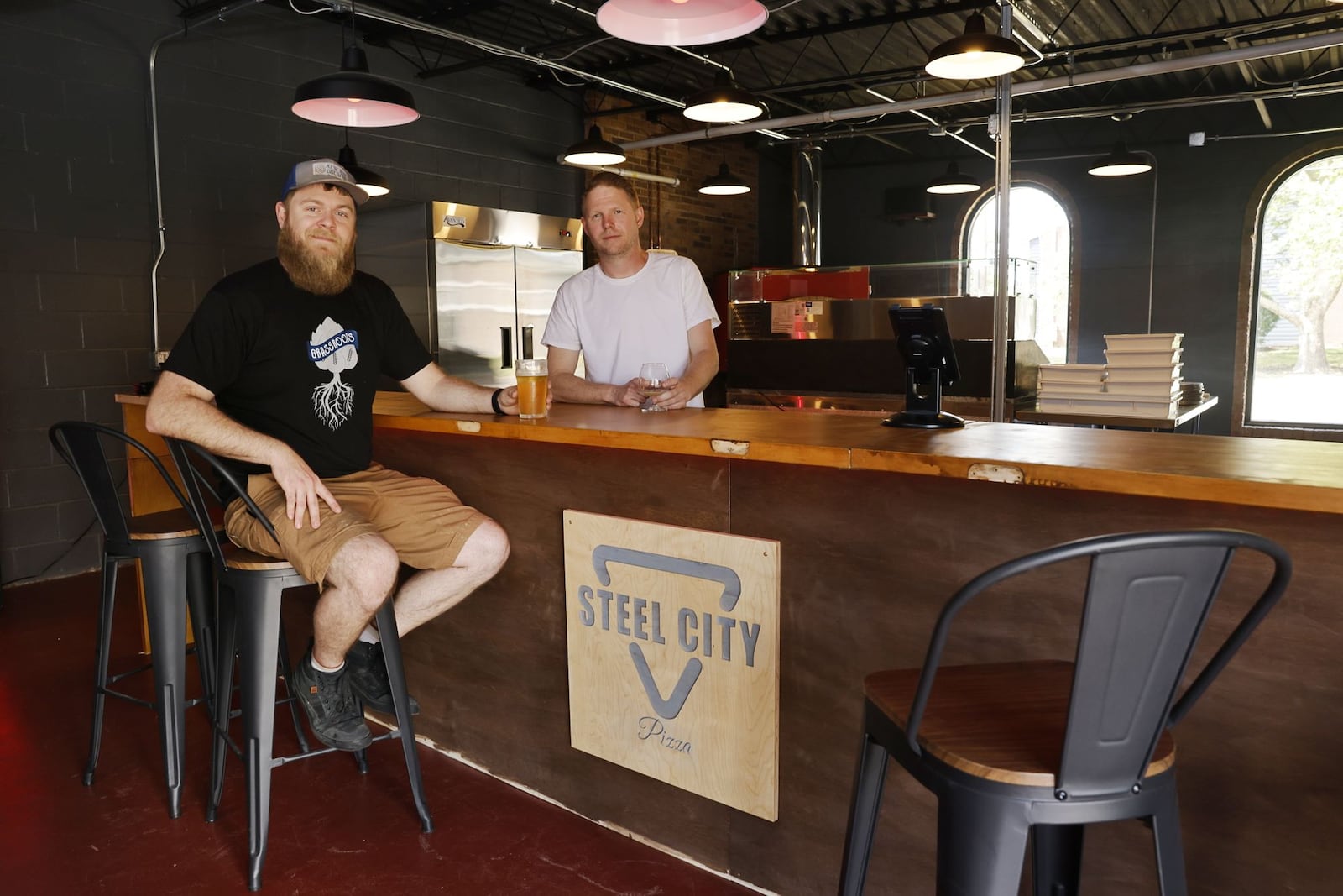 Wes Heupel, with N.E.W. Ales Brewing, left, and Jeremy Loukinas, with Steel City Pizza, are opening in the same building on Manchester Avenue in Middletown. N.E.W. Ales Brewing moved from their original location on 1st Ave.  and Steel City Pizza is opening their first location. NICK GRAHAM/STAFF