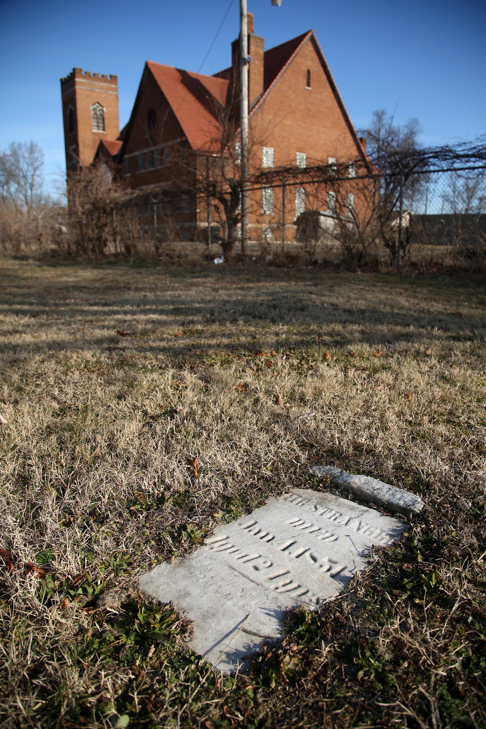 A tombstone labeled “THE STRANGER” marks the grave of a young woman buried at Old Greencastle Cemetery in Dayton. LISA POWELL / STAFF